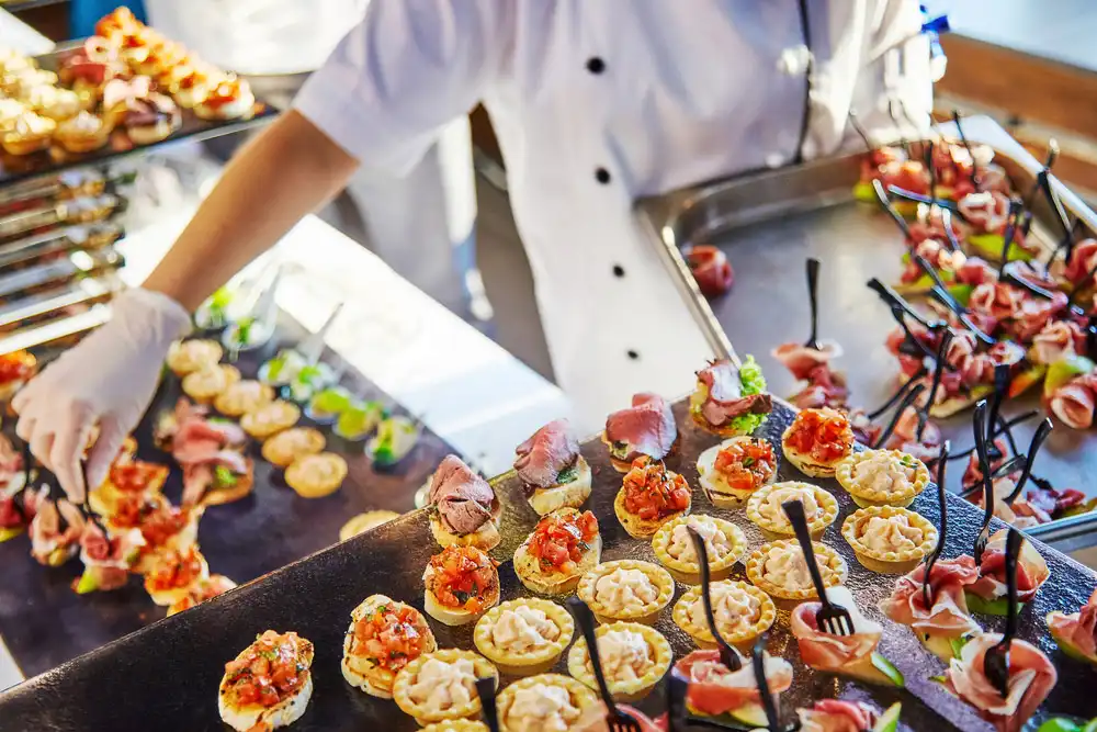 catering staff preparing food for large event