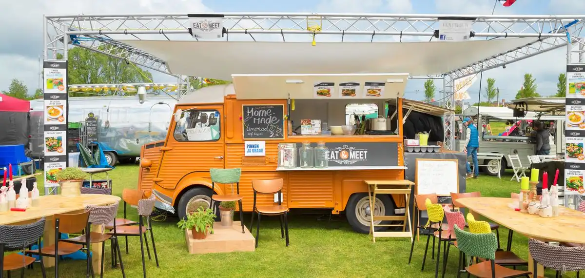 food truck staff cooking and serving street food