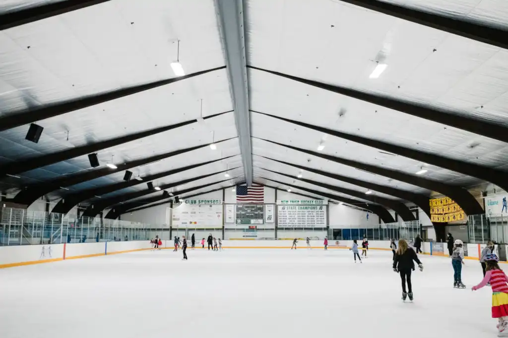 ice rink staff managing public skating session