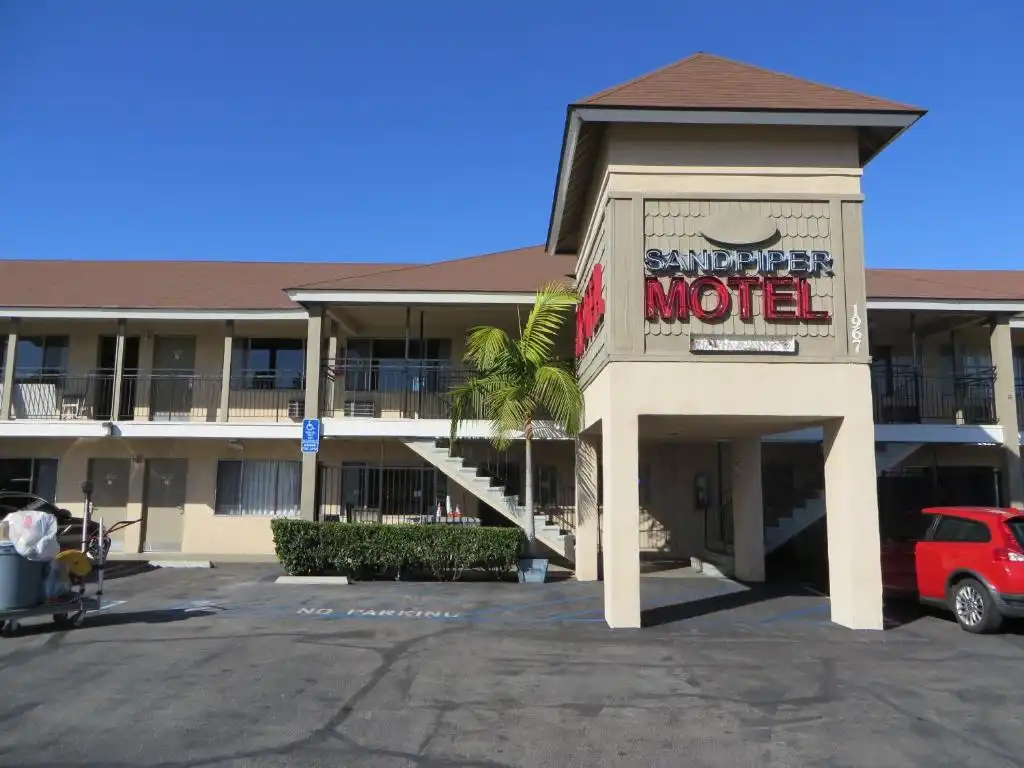 motel front desk staff checking in guests