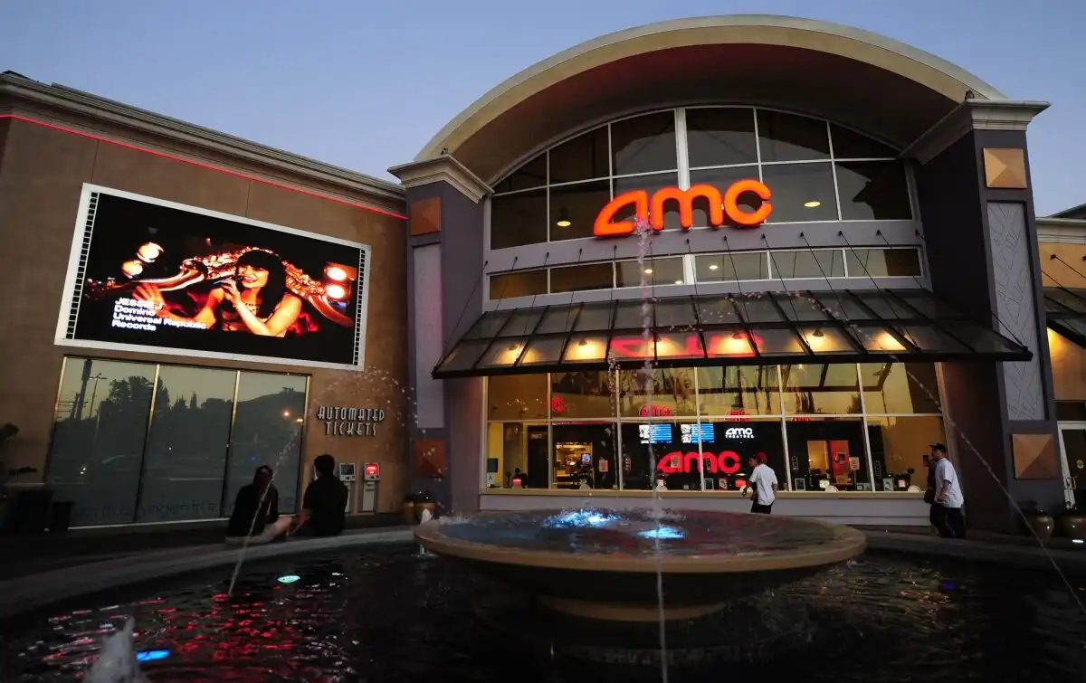 movie theater staff assisting guests at ticket counter