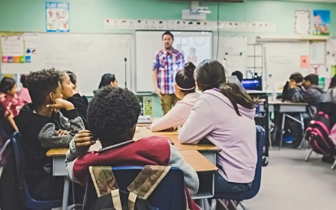 public school staff assisting students on campus