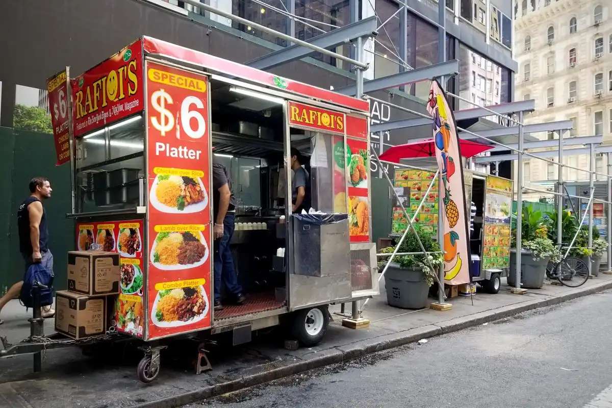 street vendor preparing food for customers