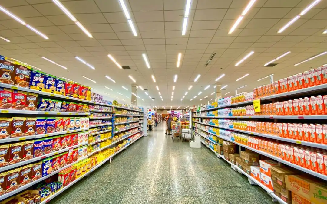 supermarket employees assisting shoppers